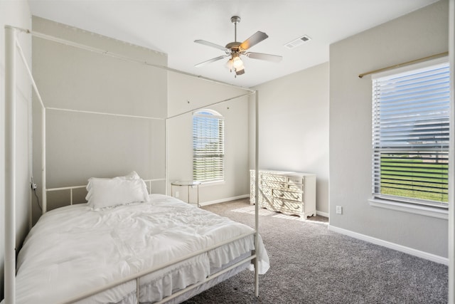 carpeted bedroom with ceiling fan