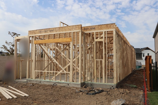 view of gate featuring an outbuilding