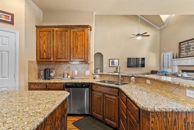 kitchen with ceiling fan, sink, dark wood-type flooring, high vaulted ceiling, and dishwasher