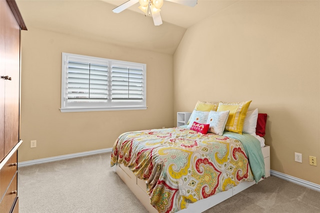 bedroom featuring vaulted ceiling, ceiling fan, and light colored carpet