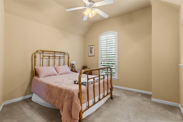 bedroom with ceiling fan, light carpet, and vaulted ceiling