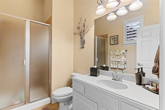 bathroom with vanity, tile patterned floors, an enclosed shower, and toilet