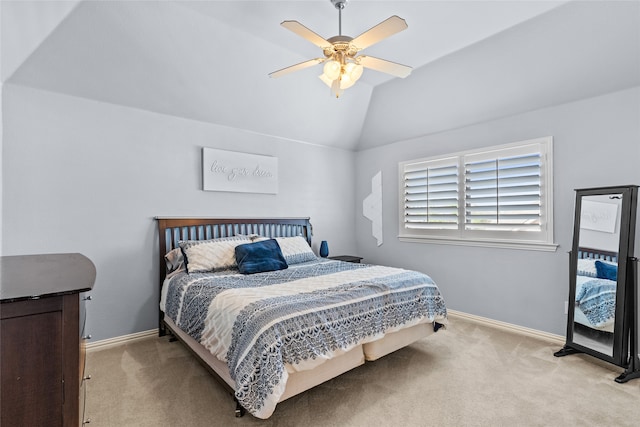 carpeted bedroom featuring vaulted ceiling and ceiling fan