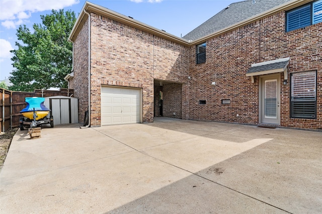 view of home's exterior featuring a patio area and a garage