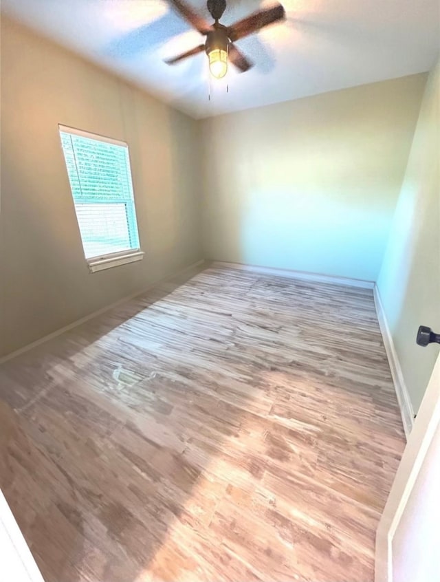 unfurnished room featuring ceiling fan and light hardwood / wood-style flooring