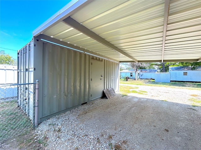 garage featuring a carport