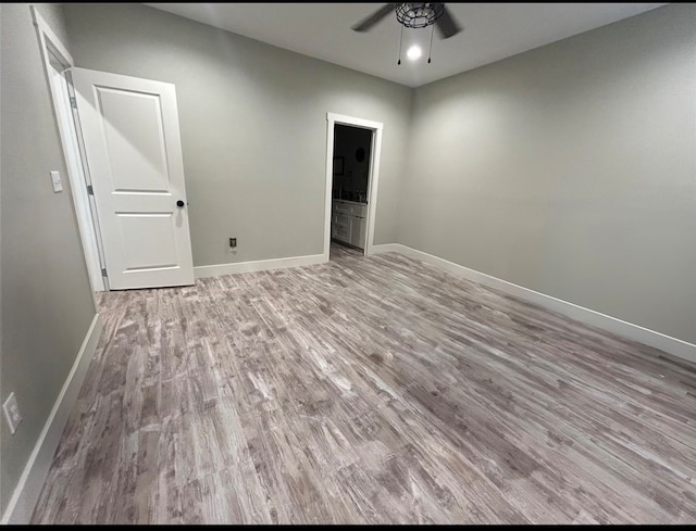 unfurnished room with ceiling fan and light hardwood / wood-style flooring