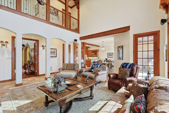 living room featuring a high ceiling