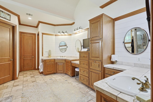 bathroom with vanity and crown molding