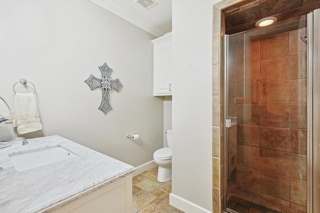 bathroom featuring ornamental molding, vanity, an enclosed shower, and toilet