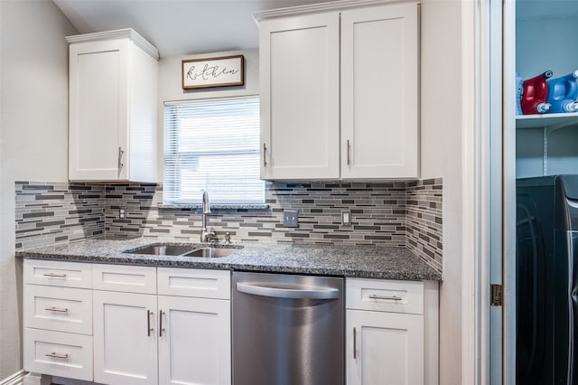 kitchen with white cabinets, sink, stainless steel dishwasher, dark stone counters, and decorative backsplash