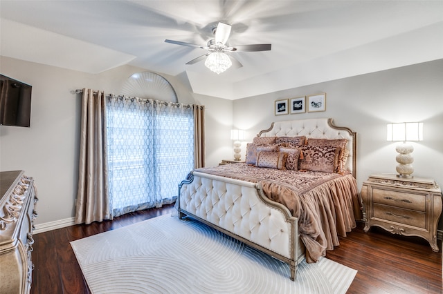 bedroom with dark hardwood / wood-style flooring and ceiling fan