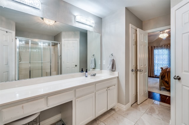 bathroom featuring vanity, hardwood / wood-style floors, and an enclosed shower