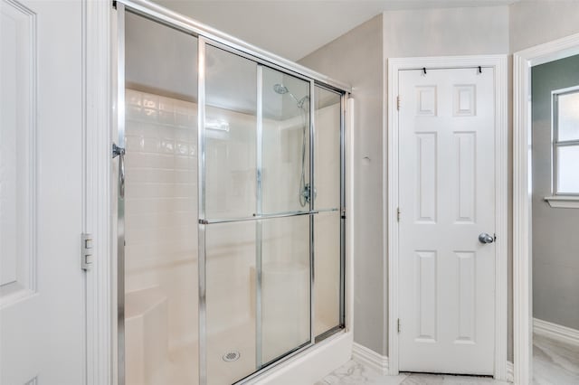 bathroom featuring an enclosed shower