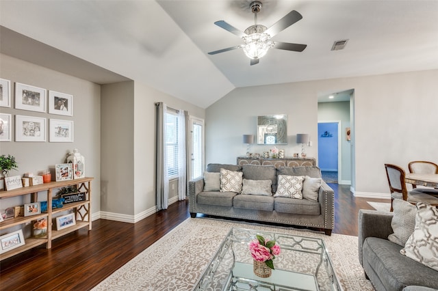 living room featuring lofted ceiling, ceiling fan, and dark hardwood / wood-style floors