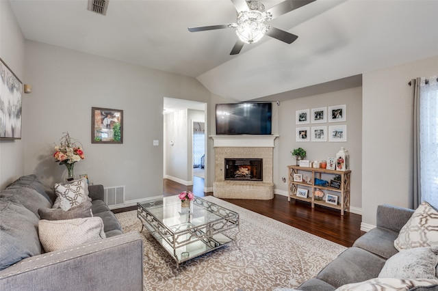 living room with lofted ceiling, ceiling fan, and dark hardwood / wood-style floors