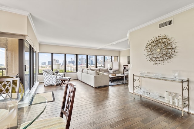 living room with ornamental molding and dark hardwood / wood-style floors