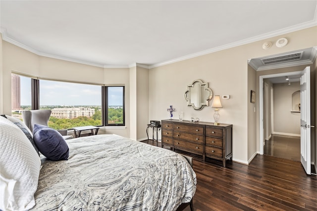 bedroom featuring dark hardwood / wood-style floors and crown molding