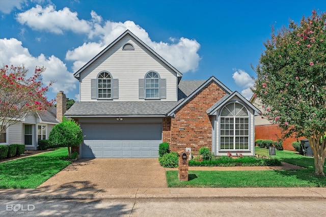 view of front property featuring a garage and a front lawn