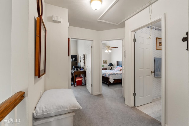 hall with light colored carpet