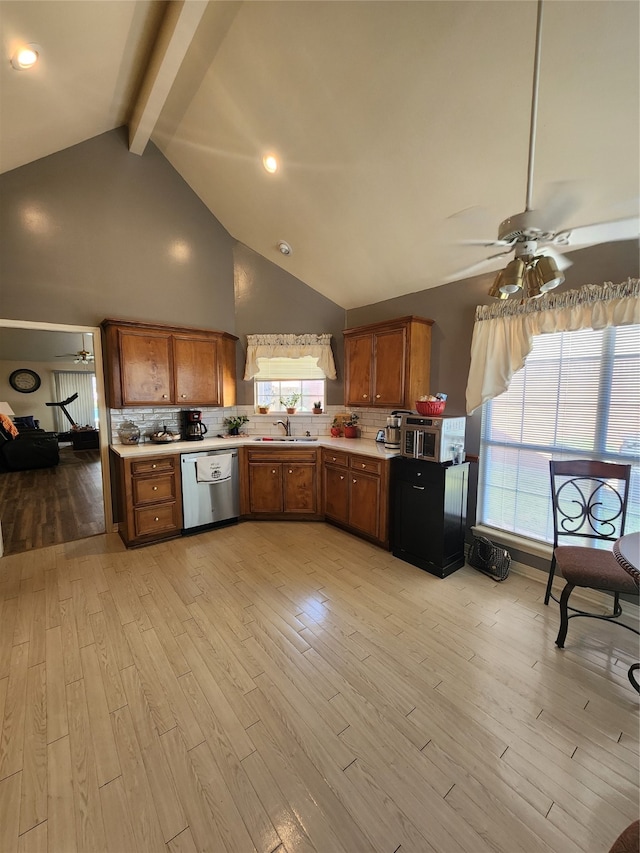 kitchen featuring ceiling fan, beam ceiling, dishwasher, light hardwood / wood-style floors, and decorative backsplash