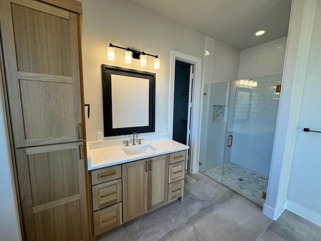 bathroom with walk in shower and vanity