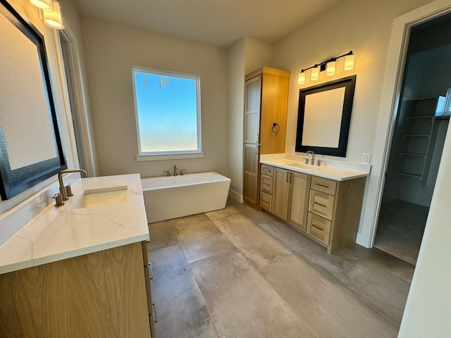 bathroom with a bathing tub and vanity