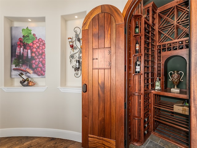 wine cellar with hardwood / wood-style floors