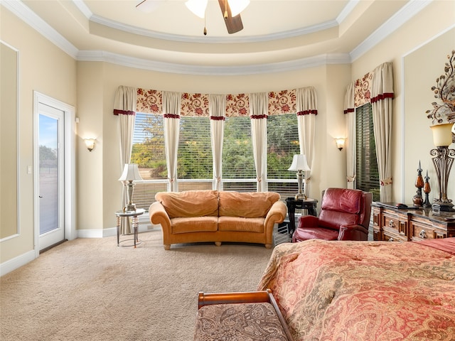 bedroom with ceiling fan, a raised ceiling, access to outside, and carpet floors