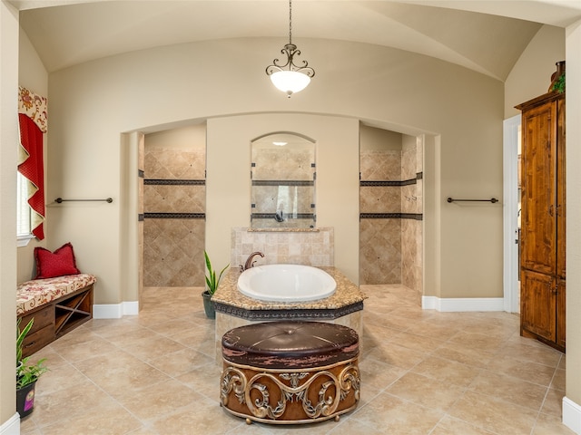 bathroom featuring shower with separate bathtub, vaulted ceiling, and tile patterned flooring