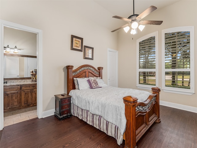 bedroom featuring sink, ceiling fan, ensuite bathroom, and dark hardwood / wood-style floors