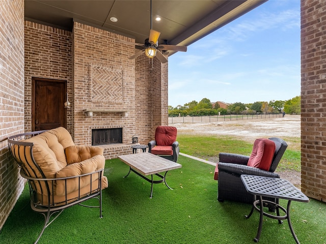 view of patio featuring ceiling fan and an outdoor living space