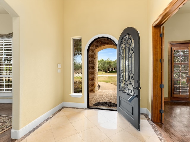 foyer entrance featuring light hardwood / wood-style flooring and a wealth of natural light