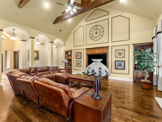 living room with beam ceiling, dark wood-type flooring, decorative columns, high vaulted ceiling, and ceiling fan with notable chandelier