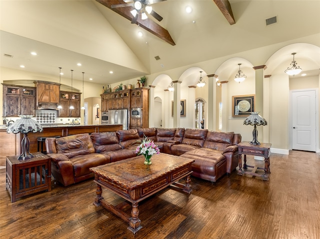 living room featuring decorative columns, ceiling fan, beam ceiling, high vaulted ceiling, and dark hardwood / wood-style floors