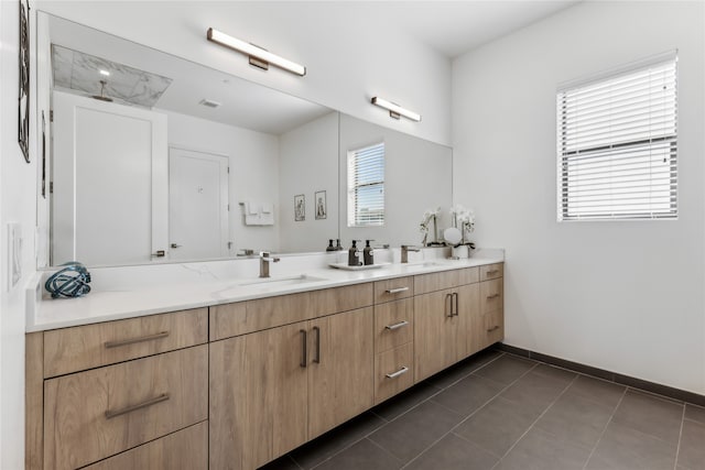 bathroom with vanity and tile patterned floors