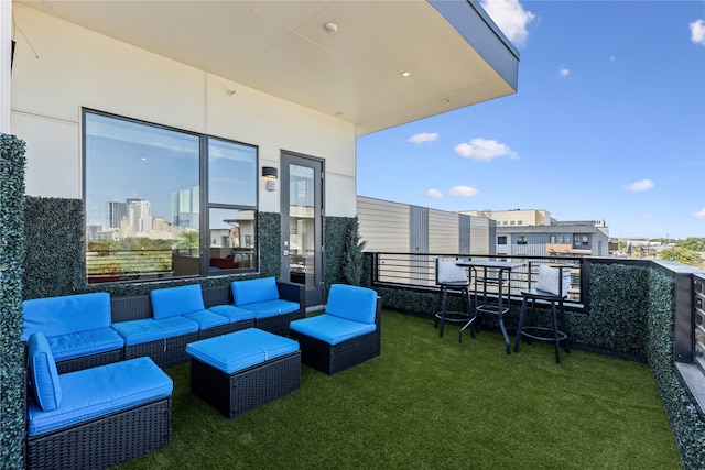 exterior space with an outdoor living space and a balcony