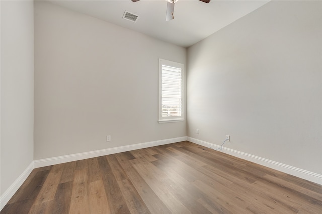 empty room featuring ceiling fan and hardwood / wood-style flooring