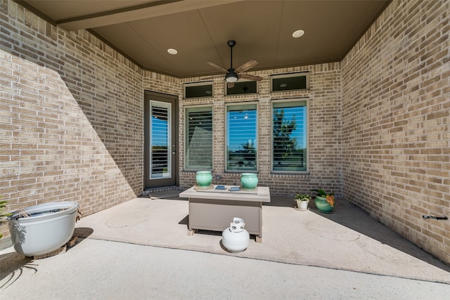 view of patio featuring ceiling fan