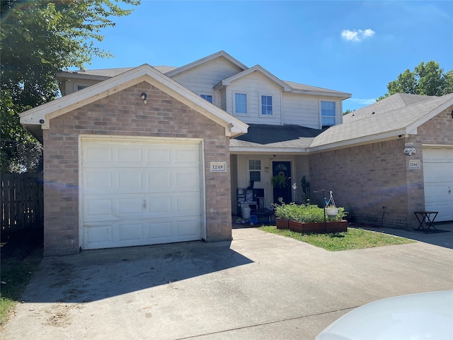 view of front of property with a garage