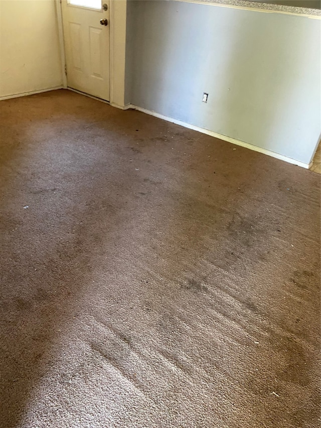 spare room featuring carpet floors