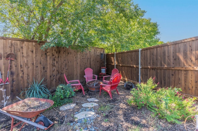 view of yard with an outdoor fire pit