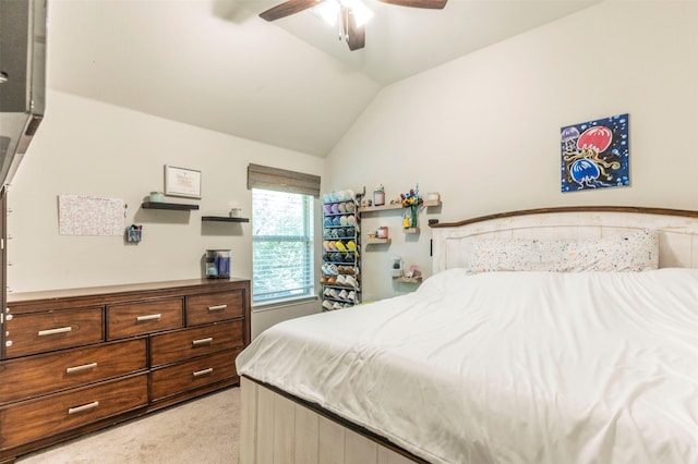 carpeted bedroom featuring lofted ceiling and ceiling fan