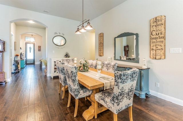 dining space with dark wood-type flooring