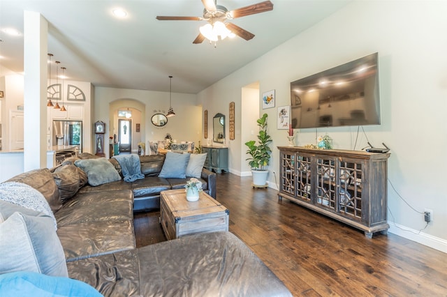 living room featuring dark hardwood / wood-style flooring and ceiling fan