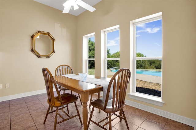 dining room featuring ceiling fan and tile patterned floors