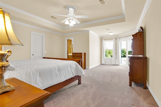 carpeted bedroom featuring ceiling fan, a raised ceiling, access to exterior, and crown molding