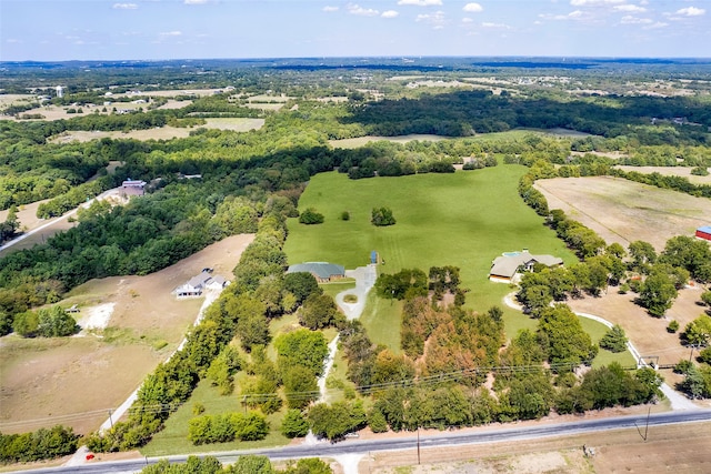 birds eye view of property featuring a rural view