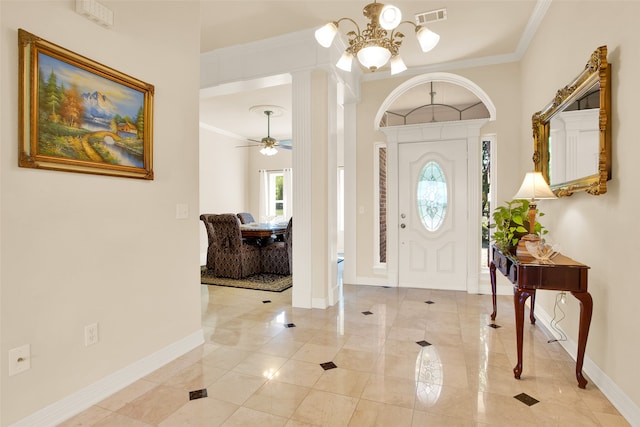 entrance foyer with crown molding and ceiling fan with notable chandelier