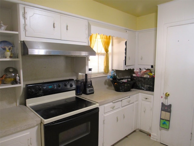 kitchen featuring white electric range and white cabinetry